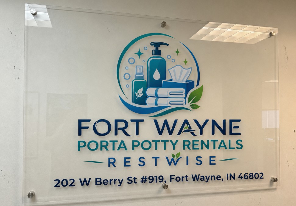 Restwise glass logo sign showing the address 202 W Berry St #919
